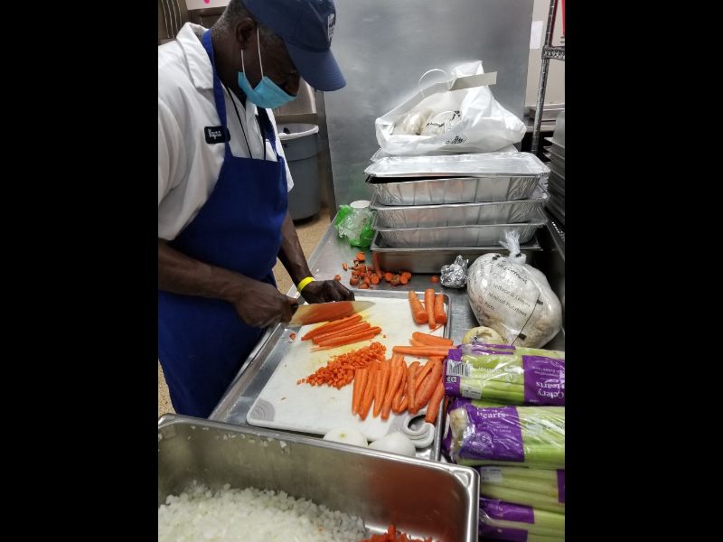 Chef Cunningham preparing vegetables for a hot nutritious meal.  St Vinnys Bistro serves meals to an average of 400-475 homeless every day.