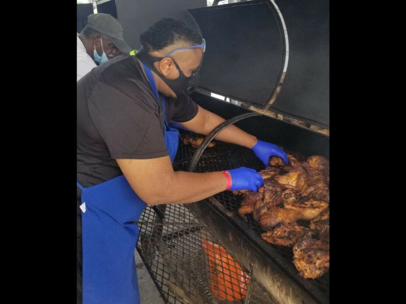 Chef Lorris preparing BBQ chicken at St Vinnys Bistro for 675 of our brothers and sisters.  Some homeless are dinning at our Bistro and others are eating at an off-site location.